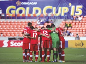 Canada players huddle before their Gold Cup match against Jamaica on Saturday. Canada has yet to score in the tournament. (AP)