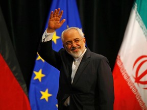 Iranian Foreign Minister Mohammad Javad Zarif waves after a plenary session at the United Nations building in Vienna, Austria, on July 14, 2015. Iran and six major world powers reached a nuclear deal on Tuesday, capping more than a decade of on-off negotiations with an agreement that could potentially transform the Middle East, and which Israel called an "historic surrender". (REUTERS/Leonhard Foeger)