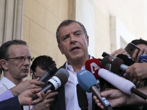 Leader of the centre-left To Potami party Stavros Theodorakis addresses media outside the parliament building in Athens, Greece July 14, 2015. Theodorakis said on Tuesday his group would support Prime Minister Alexis Tsipras' bailout deal in parliament but he ruled out joining a government led by the leftist Syriza party. ( REUTERS/Yiannis Kourtoglou)