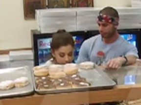 Ariana Grande was caught licking and spitting on doughnuts in a California pastry shop last week. (YouTube)