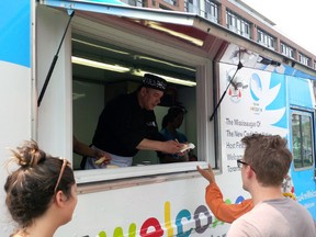 Chef David Wolfman serves up traditional aboriginal dishes to visitors for the Pan Am Games. (Handout)