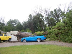 Trees and power lines came down near Grand Bend as a severe storm moved through Lambton Shores on July 27, 2014. Damage to one property  is shown in this file photo taken right after the storm. While much of the cleanup has been carried out, some signs of the storm still remain in the community.  (File photo/Postmedia Network)