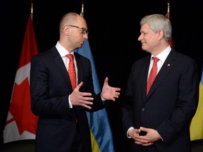 Prime Minister Stephen Harper, right, meets with Arseniy Yatsenyuk, Prime Minister of Ukraine at Willson House in Chelsea, Que., on Tuesday, July 14, 2015. THE CANADIAN PRESS/Sean Kilpatrick