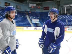 Sudbury Wolves overagers Brody Silk, left, and Jeff Corbett share a laugh at practice at Sudbury Community Arena on March 12, 2015. The duo will continue to be teammates next season as both have signed on to play for Brock University.