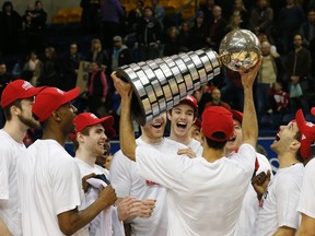 Carleton Ravens celebrate their win  as they defeated Ottawa 93-46 to win the CIS university national basketball championship in Toronto, Ont. on Sunday March 15, 2015. Michael Peake/Postmedia Network