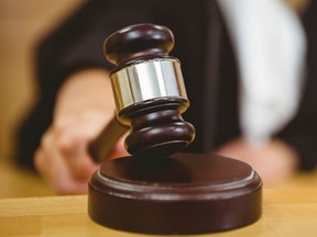A Nova Scotia woman who says she doesn't remember the events in question was sentenced to nine months probation and six-month curfew for "mutually masturbating" a fellow passenger and kicking holes in an airport holding room. (Fotolia)