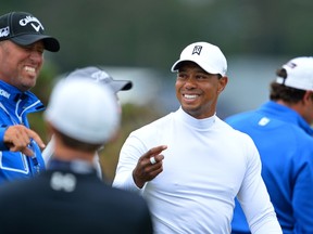 Tiger Woods smiles during practice on The Old Course at St Andrews in Scotland, on July 14, 2015, ahead of The 2015 Open Golf Championship which runs July 16-19. AFP PHOTO / GLYN KIRK