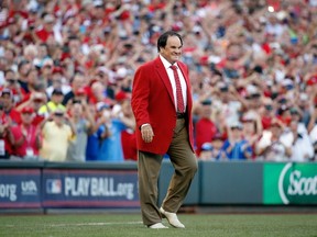 Former player Pete Rose is given a large ovation as he walks on to the field at the Great American Ball Park in Cincinnati prior to last night’s MLB all-star game. (Getty Images/AFP)