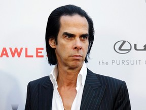Writer and composer Nick Cave poses at the premiere of the film "Lawless" in Los Angeles August 22, 2012. REUTERS/Danny Moloshok
