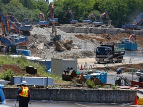 In this May 13, 2015 file photo, Japan's National Stadium is dismantled for the renovation for the 2020 Tokyo Olympic Games. When the dust settles on the marquee venue for the 2020 Summer Olympics in Tokyo, it could well be the most expensive sports stadium in the world. (AP Photo/Shizuo Kambayashi, File)