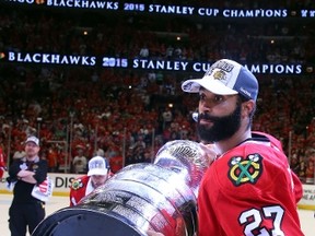 After winning two cups with the Chicago Blackhawks, Johnny Oduya is headed to the Dallas Stars.  (Bruce Bennett/AFP)