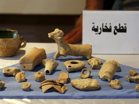 Recovered artifacts are seen at the National Museum of Iraq in Baghdad on July 15, 2015. The U.S. handed back to Iraq on Wednesday antiquities it said it had seized in a raid on Islamic State fighters in Syria. (REUTERS/Thaier Al-Sudani)