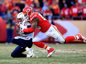 Kansas City Chiefs inebacker Justin Houston sacks San Diego Chargers quarterback Philip Rivers during NFL play at Arrowhead Stadium on December 28, 2014 in Kansas City, Mo. (Jamie Squire/Getty Images/AFP)