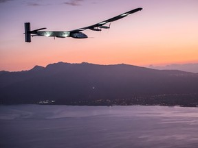 The Solar Impulse 2 airplane, piloted by Andre Borschberg, prepares to land at Kalaeloa airport after flying non-stop from Nagoya, Japan in Kapolei, Hawaii in this July 3, 2015 handout photo. (REUTERS/Solar Impulse/Revillard/Rezo.ch/Handout via Reuters)