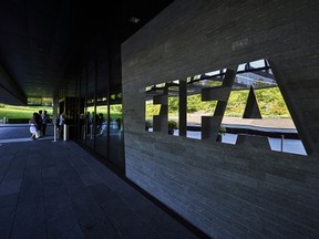 FIFA employees entering the FIFA headquarters in Zurich. (AFP/MICHAEL BUHOLZER/GETTY IMAGES)
