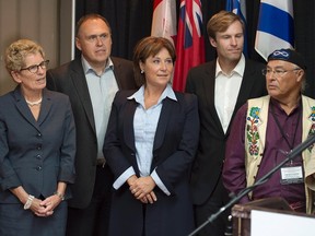 Ontario Premier Kathleen Wynne, left to right, Yukon Premier Darrell Pasloski, British Columbia Premier Christy Clark, New Brunswick Premier Brian Gallant and Clement Chartier, president, Metis National Council attend a news conference at a meeting of Canadian premiers and national aboriginal leaders in Happy Valley-Goose Bay, Newfoundland and Labrador on Wednesday, July 15, 2015. THE CANADIAN PRESS/Andrew Vaughan