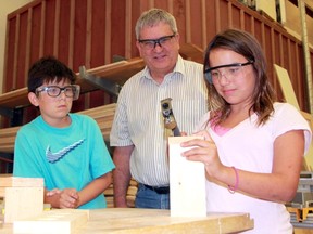 Jeff Murrell, the associate dean of apprenticeship and skilled trades training at Lambton College, supervises two Skills Ontario work camp students at the college's carpentry facility on Wednesday July 15, 2015 in Sarnia, Ont. (Terry Bridge/Sarnia Observer/Postmedia Network)