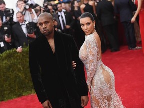 Kanye West (L) and Kim Kardashian attend the "China: Through The Looking Glass" Costume Institute Benefit Gala at the Metropolitan Museum of Art on May 4, 2015 in New York City. (Mike Coppola/Getty Images/AFP)