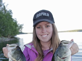 Ashley Rae holds two largemouth bass caught and released in Quebec.
(Supplied photo)