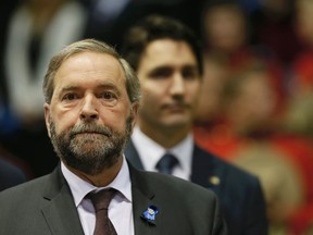 New Democratic Party leader Thomas Mulcair (L) and Liberal leader Justin Trudeau on June 10, 2014.  REUTERS/Christinne Muschi/Files