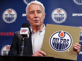 Oilers Entertainment Group CEO Bob Nicholson displays the golden card drawn during the NHL Draft Lottery in the spring. (Ian Kucerak, Edmonton Sun)