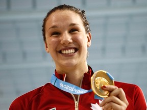 Winnipeg's Chantal Van Landeghem poses with her gold medal after the women's 100m freestyle swimming final. (Rob Schumacher-USA TODAY Sports)