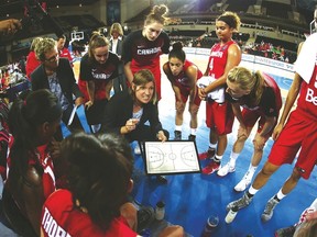 Canadian women’s basketball team coach Lisa Thomaidis draws up a play during a timeout. The team begins its Pan Am Games play tonight against Venezuela. (Canada Basketball photo)