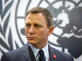 Actor Daniel Craig listens to speakers at a service designating him as the UN Global Advocate for the Elimination of  Mines and Explosive Hazards at the United Nations Headquarters in New York April 14, 2015. REUTERS/Lucas Jackson