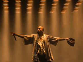 Kanye West performing at Bluesfest in Ottawa on July 10, 2015. An online petition is asking the Pan Am Games organizing committee to replace West with a Canadian artist to headline the closing ceremonies later this month. (Errol McGihon/Postmedia Network)
