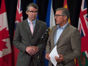 Nova Scotia Premier Stephen McNeil, left, and Newfoundland and Labrador Premier Paul Davis field questions at the summer meeting of Canada's premiers in St. John's on Thursday, July 16, 2015. (THE CANADIAN PRESS/Andrew Vaughan)