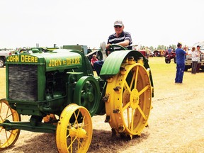 Gerald Lewis drives a 1925 John Deere Model D 'Spoke’d' Fly Wheel tractor that will be at the museum’s annual show along with many other early era John Deere tractors. Submitted photo.