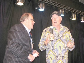 Mike Love of the Beach Boys and Chatham Rotary Club past president Don “Sparky” Leonard lead a sing-a-long at the 75th Rotary Banquet in this file photo taken on Nov. 9, 2014. Love will be returning to Chatham on Aug. 8, 2015, when the Beach Boys will perform in concert at Tecumseh Park. (FILE PHOTO/ Postmedia Network)
