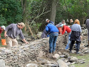 Professional wallers lead a workshop last fall on dry stone wall construction. (Supplied by Brian Little)