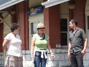 Filmmaker Shirley Cheechoo, middle, speaks with actors Micheline Blais, of Greater Sudbury, and Matthew Manitowabi on location at the VIA Rail train station in Sudbury in July 2012. Cheechoo was shooting at the station for her film, Moose River Crossing, which she wrote and is directing.