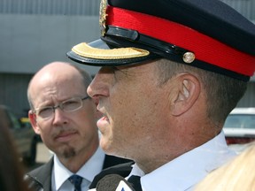 Supt. Kevin Galvin (r) and Karl Wilberg, Director Civil Forfeiture Office speaks to the media on the recent road rage incident where police seized the vehicle in Edmonton, Alberta on Tuesday, August 13, 2013.  Perry Mah/Edmonton Sun/Postmedia Network