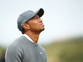 Tiger Woods of the U.S. walks onto the 16th green during the first round of the British Open golf championship on the Old Course in St. Andrews, Scotland, July 16, 2015.     REUTERS/Lee Smith