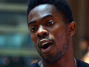 Rodney Diverlus speaks after a protest at police headquarters in Toronto on July 16, 2015. (Dave Abel/Toronto Sun)