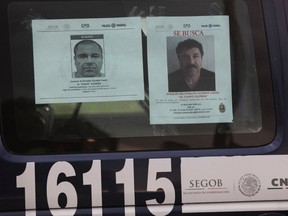 A Mexican Federal Police vehicles displays a wanted notice and a reward notice for information leading to the capture of drug lord Joaquin "El Chapo" Guzman, on a highway west of Mexico City, Thursday, July 16, 2015. The Mexican government is offering a reward of $3.8 million (60 million pesos) for Guzman's recapture, who made his escape Saturday from the Altiplano maximum security prison via an underground tunnel. (AP Photo/Marco Ugarte)