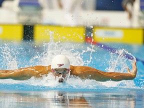 Canada’s Santo Condorelli churns his way to a bronze medal in the men’s 100-metre butterfly last night in Scarborough. (MICHAEL PEAKE, Toronto Sun)