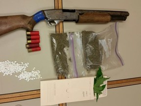 Members of the OPP Drug Enforcement Unit, Emergency Response Team and Canine Unit seized prohibited weapons and $4,500 in drugs.  Supplied Photo