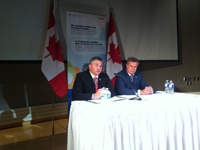 Selkirk-Interlake MP James Bezan (left) and Elmwood-Transcona MP Lawrence Toet at the press conference to announce four new projects to improve Canada's ability to respond to natural disasters such as flooding and address public health emergencies Friday July 17, 2015 at the National Microbiology Laboratory in Winnipeg.