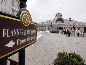 In this June 19, 2015 photo, guests are escorted to their seats for the wedding of Danessa Molinder and Billy Castrodale in an open air courtyard at the Community Life Center, in Indianapolis. The somewhat ironically named Community Life Center sits on cemetery land near a funeral home and also has hosted proms and community banquets.