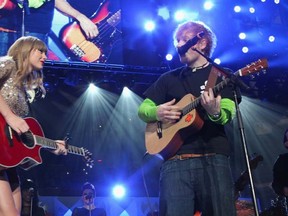 Taylor Swift and Ed Sheeran perform onstage during Z100's Jingle Ball 2012, presented by Aeropostale, at Madison Square Garden on December 7, 2012 in New York City.  Kevin Kane/Getty Images for Jingle Ball 2012/AFP