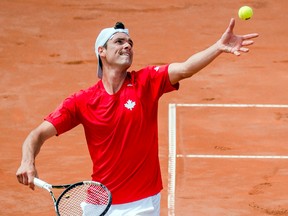 Canada's Frank Dancevic serves to Belgium's Steve Darcis during the first singles match of the Davis Cup World Group Quarterfinals between Belgium and Canada, in Middelkerke, Belgium, on Friday, July 17, 2015. (Geert Vanden Wijngaert/AP Photo)