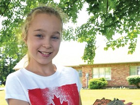 Rachel Thurston, 11, with her 2014-15 speed skating medals. CHRIS ABBOTT/TILLSONBURG NEWS