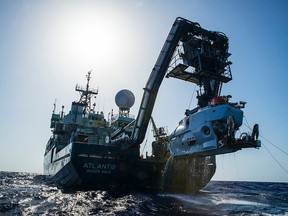 In this image released by, The Woods Hole Oceanographic Institution, the research vessel Atlantis is shown off the coast of the Carolinas in the Atlantic Ocean during the second week of July 2015 with the submersible Alvin hanging off its stern. The expedition led by Duke University marine scientist Cindy Van Dover has found a shipwreck that may date back to the late 1700s. Luis Lamar/Woods Hood Oceanographic Institution via AP