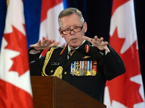 New Chief of Defence Staff Gen. Jonathan Vance gestures as he speaks during a change of command ceremony in Ottawa, Friday, July 17, 2015. THE CANADIAN PRESS/Adrian Wyld