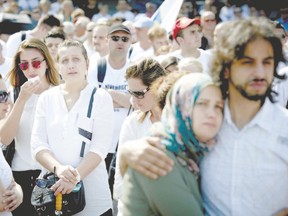 Mourners attend the Srebrenica Peace March in The Hague on July 11 in remembrance of the victims of the 1995 Srebrnica massacre of around 8,000 Muslim men and boys, killed by Bosnian Serb forces. Gwynne Dyer says Bosnian Serbs ? like many others who caused mass killings ? cannot bring themselves to admit to genocide. (MARTIJN BEEKMAN, AFP Photo)