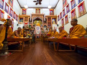 Monks from Namgyal Monastery in India conduct a ceremony of consecration at Gaden Samten's Alberta Centre for Peace and Meditation in Edmonton, Alta., on Thursday July 16, 2015. The elaborate rite transforms the statues of the centre into actual Buddhas. Abbott Thrumthog Rinpoche lead the rite. Ian Kucerak/Edmonton Sun/Postmedia Network
