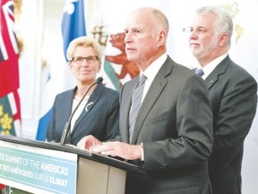 California Gov. Jerry Brown with Premier Kathleen Wynne, left, and Quebec Premier Phillipe Couillard head governments that will work together on a cap and trade scheme to reduce greenhouse gases. (Veronica Henri, Postmedia Network)